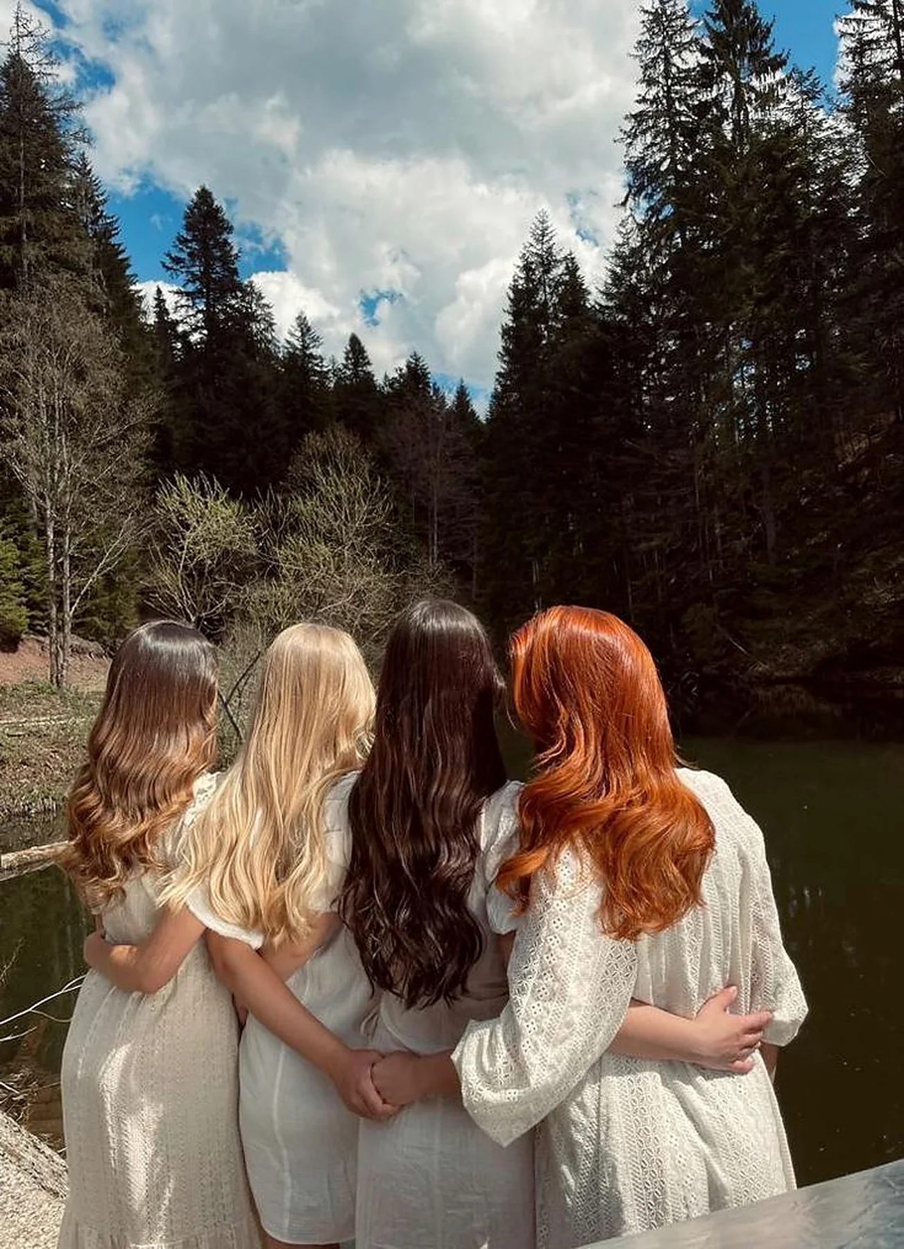 Group of women showing long copper and blonde hair